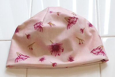 Baby Beanie in Cherry Blossom on Pink front view