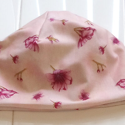 Baby Beanie in Cherry Blossom on Pink front view