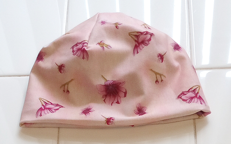 Baby Beanie in Cherry Blossom on Pink front view